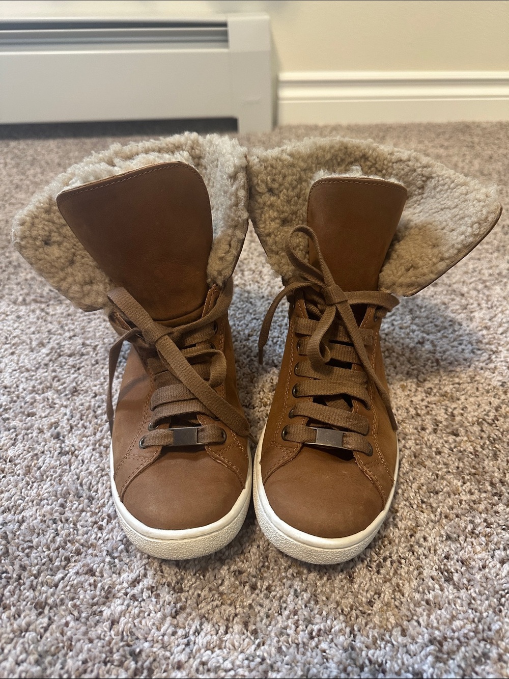Gently used Ugg woman’s Starlyn shearling high top sneaker